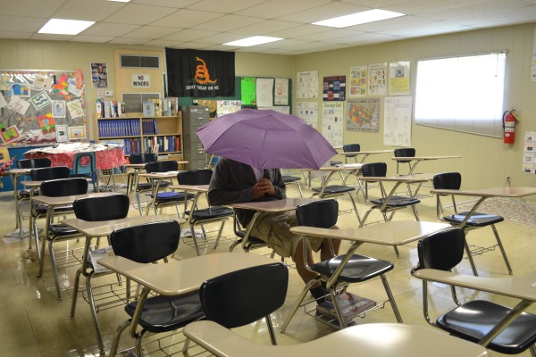 PURPLE RAIN -- provided Centrals leaky roof is not fixed soon, this could become a common sight in the classrooms
