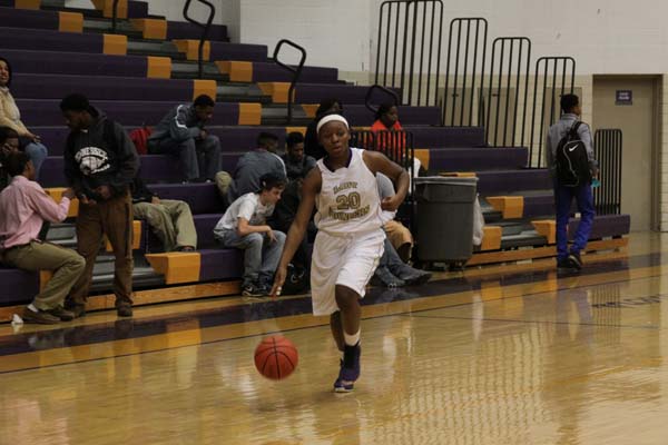 GIRLS BASKETBALL -- Sandrea Sylman dribbling up the court against Hixson. She had 15 points.