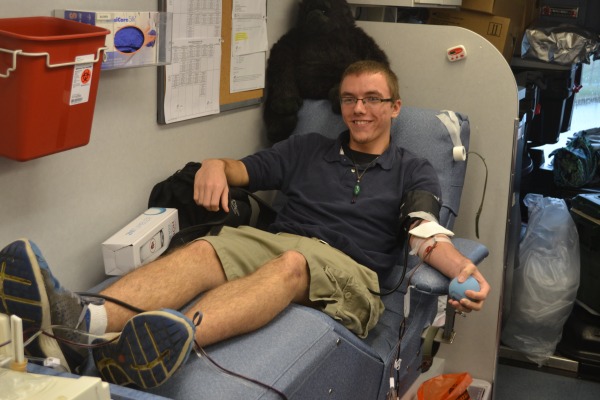 SENIOR DONATES BLOOD -- Brian Greene generously gives his blood for others. 