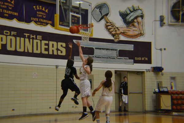 CLOSE CALL -- Rebecca Hill and
Shamiyah Jones try to defend