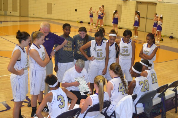 TEAM MEETING -- Coach Rick May talks to his team during a break in the game. File photo from 2013 season.