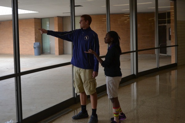 CALLED TO LEAD -- Brandon Lewis guides freshman Monet Henderson around the Central.