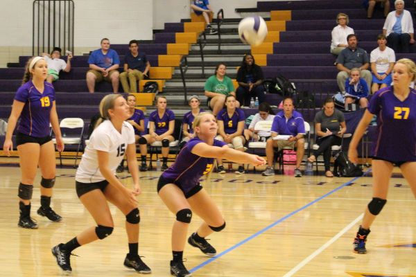 EYES ON THE BALL -- Centrals Brooke Parrott (right) goes for a dig while temmate Sam Scott (left) waits nearby.