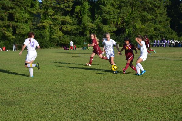 LADY POUNDERS FIGHT TO PULL OUT AT A WIN -- (From left to right) Alyssa Rosenzweig, Kerrington Severson, and Haylee Smith battle it out for a win against Howard.