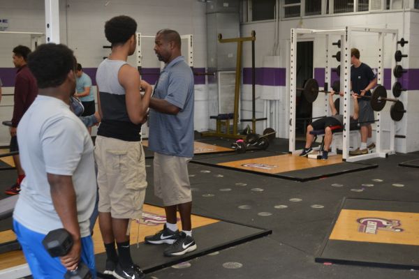 STUDENT ATHLETES PUT THE WEIGHT ROOM TO GOOD USE -- Though not totally ideal, CHS athletes use the weight room to improve during the off-seasons of their sports. 