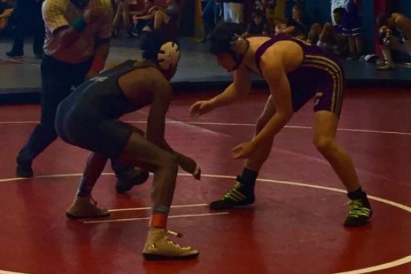 CHS WRESTLING IS GETTING OFF TO A GREAT START -- Isaac Coffman wrestles at  his first match of the seaason at Tulahoma, pushing hard for a pin.  