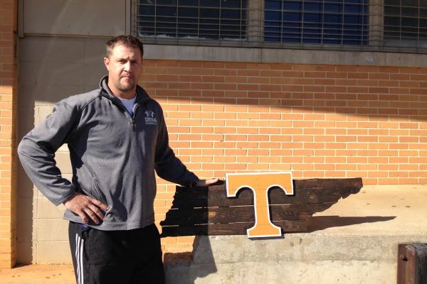 HARDWOOD HOBBY -- Centrals Coach Glen Carter  has started building wooden state and college-themed signs as a new hobby.