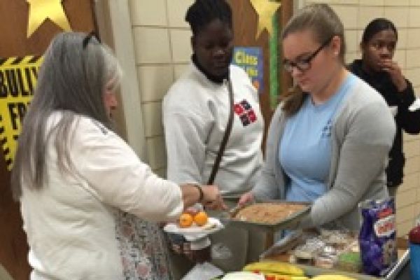 A TASTY THANK-YOU -- Mrs. Tina Staton is served by Ruriteen Club treasurer, Nicole Long.