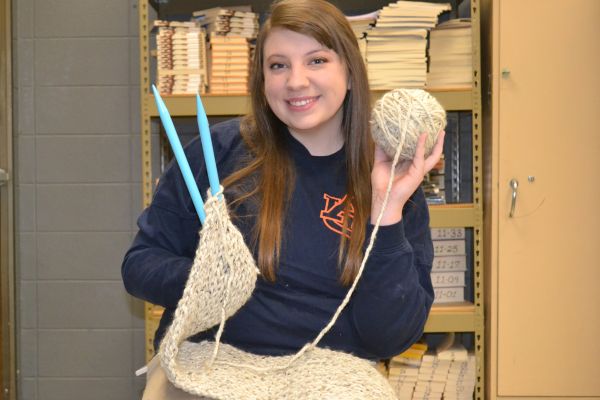 YARN AND  KNITTING PINS -- Emma Beach poses ready to knit with her yarn and pins.