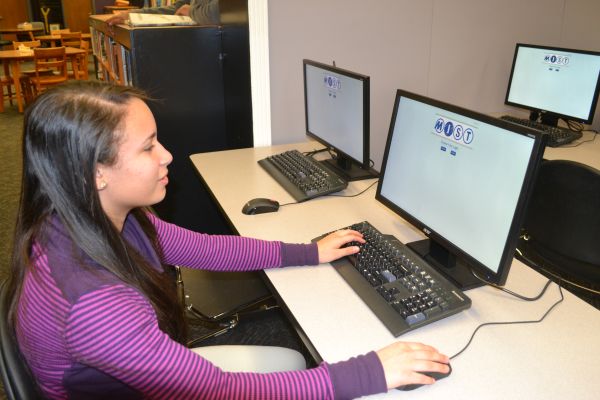 STUDENTS PREPARE FOR THE MIST TESTS-- Edicklee Frias-Cruz sits down to begin the test.