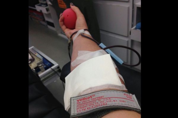 STUDENTS DONATE BLOOD TO SAVE LIVES -- Junior Alyssa Rosenzweig donates blood. 