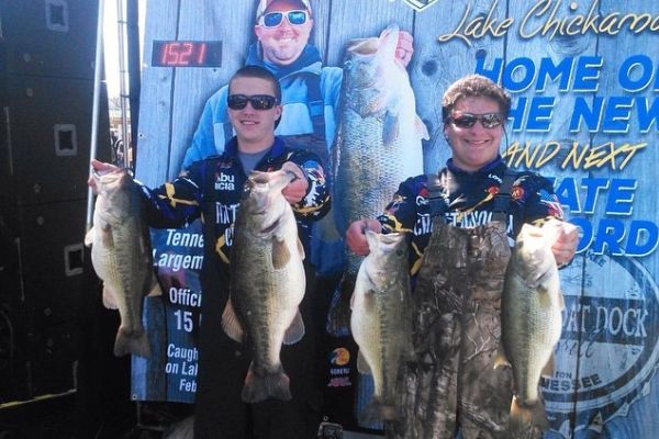 GAVIN AINSLIE AND AJ BARNES SHOW THEIR BEST CATCHES -- AJ Barnes, who received a full-ride scholarship for fishing,  stands beside Gavin Ainslie to show their best catches in the tournament. 