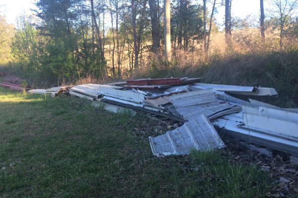 BUILDING SUPPLIES FOR INDOOR FACILITY PATIENTLY AWAIT COUNTY APPROVAL -- Building supplies have been placed behind the baseball field for the future batting cages.