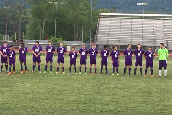 BOYS SOCCER LINES UP FOR ONE OF THEIR FINAL GAMES-- The boys soccer team lines up and gets their names called for one of their final games of the season. 