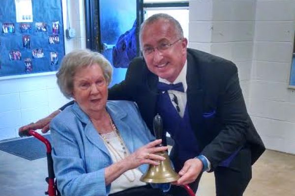 CENTRAL BELL RINGING IN MEMORIES-- Ogle donates famous bell from old Central to Mr. King at Senior Day this year