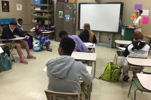 TEACHER LECTURES CLASS -- Mrs. White is teaching her students about creatively writing stories, plays, etc. 