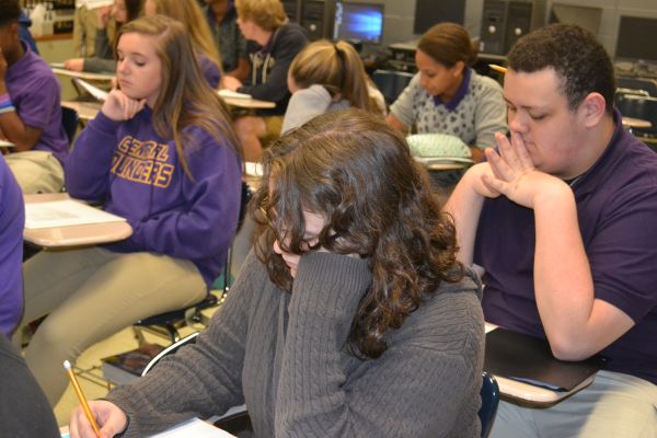 FRESHMEN HARD AT WORK -- These freshman, including (left to right) Lauren Green, Samantha Helmholtz, and James Ortiz, are very focused as they adjust into their honors English class at Central High.