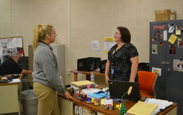 STUDENT CONSULTS WITH MS. HOOPER -- Emily Feist talks with Ms. Danielle Hooper, Central's new gifted teacher, about daily life here at school.