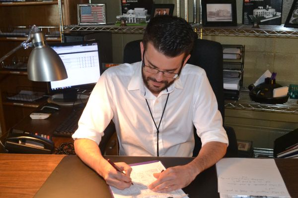 A TEACHERS JOB -- Mr. Seals is shown grading an assignment.