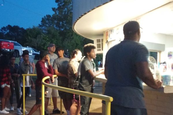 POUNDER FAMILY REPLENISHING AT HOME FOOTBALL GAME -- Central football fans and supporters line up at the concession stand for a quick grab.