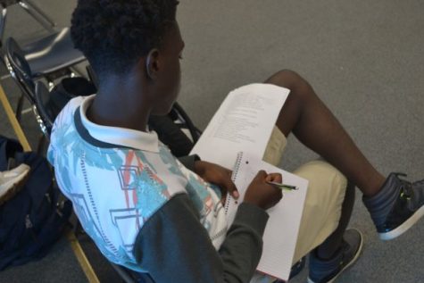 ACTING STUDENTS LEARN TO WRITE SCRIPTS -- Deshun Coonrod, one of Mrs. Whites acting students, works to optimize his script writing skills.