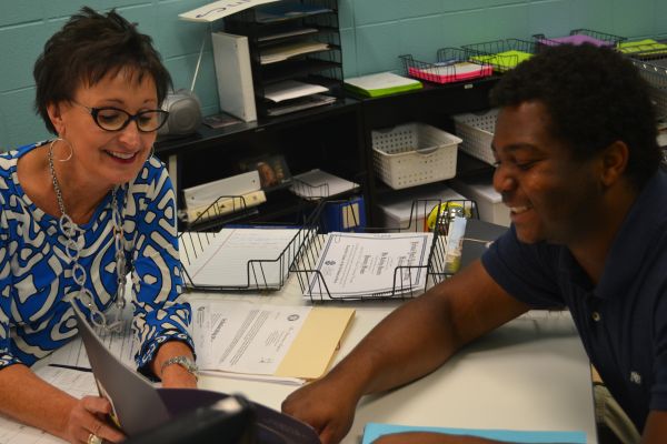 MRS. DYER IS ALWAYS DOING HER BEST TO HELP STUDENTS PREPARE FOR COLLEGE -- Dyer discusses future plans with Ruebin Thrasher, a senior at Central High School.