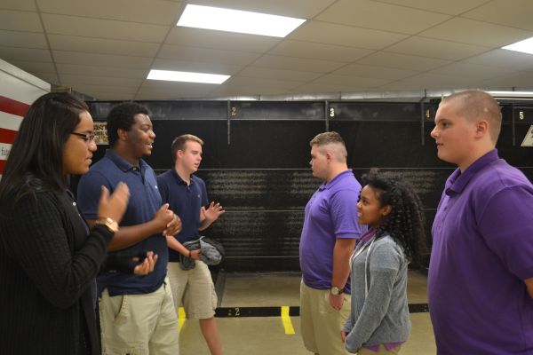 SURVIVING HIGH SCHOOL TOGETHER-- Seniors (left to right)
Alyssa Barclay, Reubin Thrasher, and Thomas Hutto give advice to freshmen (left to right) Donovan Walker, Bileah Sit, and Leonard Hussey.