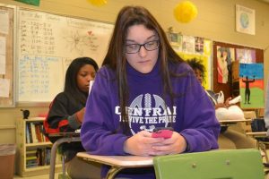 SMARTPHONES ARE CONSTANTLY HOGGING STUDENTS ATTENTION-- Sophomore student of Central High School, Caitlin Leamon, uses her smartphone during school.