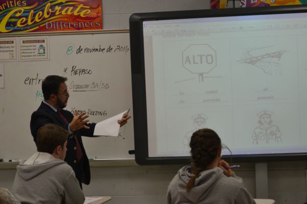 CENTRAL SPANISH TEACHER MR. JOSE SANCHEZ INSTRUCTS HIS SPANISH II CLASS--Mr. Sanchez explains to students ways to remember Spanish vocabulary words by correlating the words with English words.