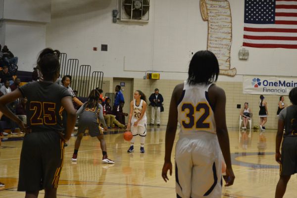 LADY POUNDERS DEFEAT THE RAMS -- The Lady Pounders shoot the final basket and win the game 39 to 40.