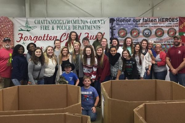 CENTRALS SOFTBALL TEAM HELPS OUT FORGOTTEN CHILD FUND --  Coach LeeAnn Shurette and the softball team at the Forgotten Child Fund warehouse last year. (2015)