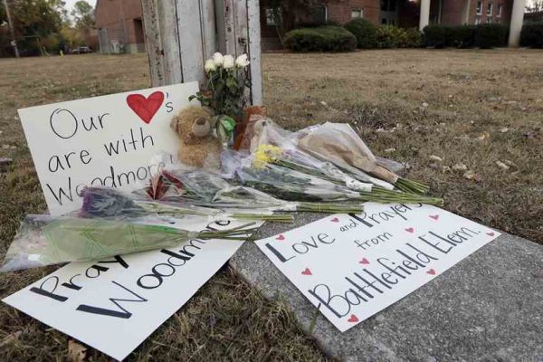 CENTRAL ALUMNI GIVE BACK AFTER WOODMORE TRAGEDY -- A memorial is placed near Woodmore Elementary adorned with flowers and signs with hopeful messages.