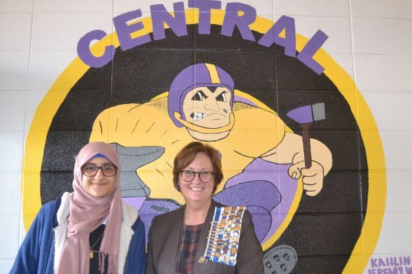 CENTRAL STUDENT ZEENA WHAYEB WINS LOCAL CHAPTER OF DAR ESSAY CONTEST -- Central sophomore student, Zeena Whayeb (left) stands with Teresa Rimer (right), the Daughters of the American Revolution  School Liason, in front of a Central mural.