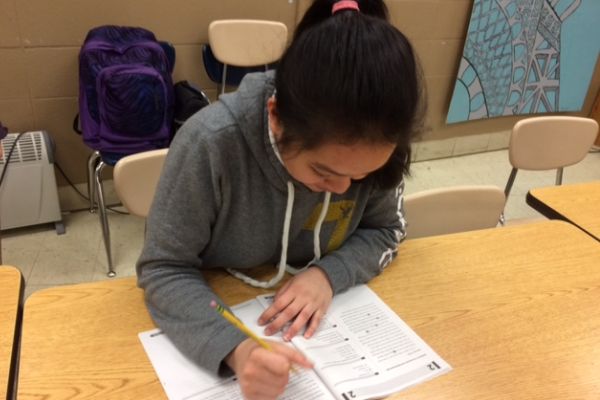 STUDENTS PRACTICE TAKING THE ACT -- Sophomore Meg Sabanal works diligently to finish her ACT practice test.