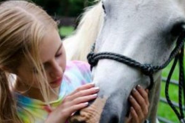 STUDENTS AND TEACHERS EXPRESS THEIR LOVE FOR NON-TRADITIONAL SPORTS-- Avionne Snakenburg poses with her horse.