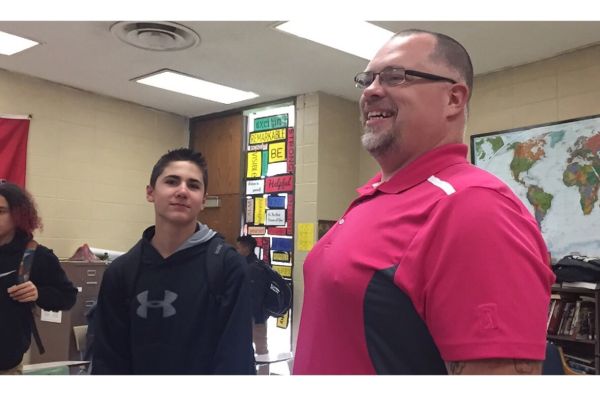 TEACHER SPOTLIGHT: WORLD HISTORY TEACHER CHRIS KRIBS IS DESCRIBED AS ONE OF THE FAVORITES-- Freshman Andrew Merriweather and Mr. Kribs seek happiness that class is over.