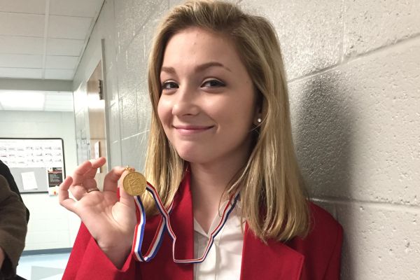 TWO STUDENTS FROM SKILLS USA PROMOTED TO NATIONALS -- Samantha Reels holds up the medal she won for Skills USA 