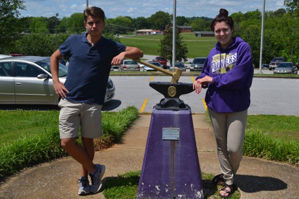 EDDY, HOLMBERG CHOSEN AS CLASS SPEAKERS OF 2017 -- Jared Eddy (left), the student representative, and Hannah Holmberg, the faculty representative, (right) pose next to the Central Hammer and Anvil. 