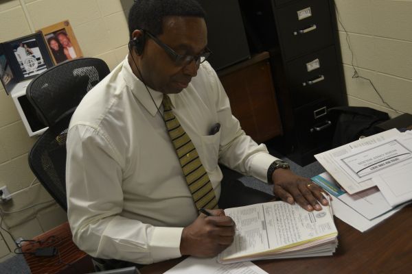 ASSISTANT PRINCIPAL FRANK JONES TO RETIRE -- Jones is found tackling the stack of referrals in his office.