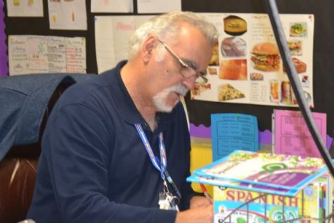 SEÑOR SOCARRAS TO RETIRE AT THE END OF THE YEAR -- Socarras completes some end of the year grading. 