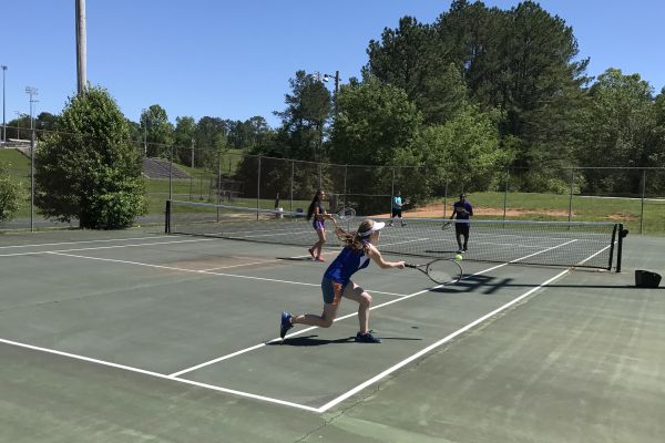 ANOTHER TENNIS SEASON WRAP UP -- The Central tennis team making due with a limited amount of courts and many players at practice.