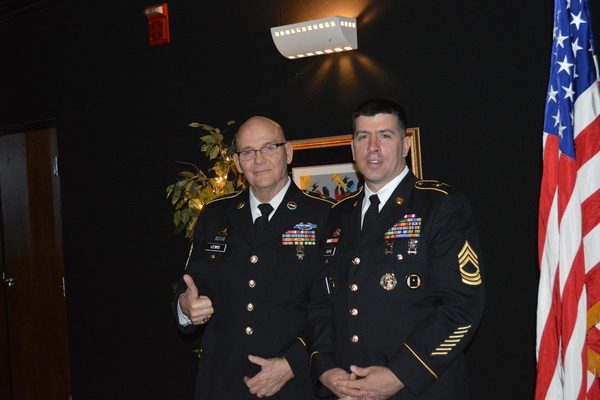 SERGEANT MAJOR LEWIS IS RETIRING AFTER 17 YEARS OF JROTC -- Sergeant Major Lewis stands beside Master Sergeant Dupre in full uniform.