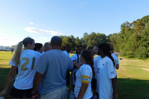 HUDDLE TIME -- Girls soccer team huddles before second half