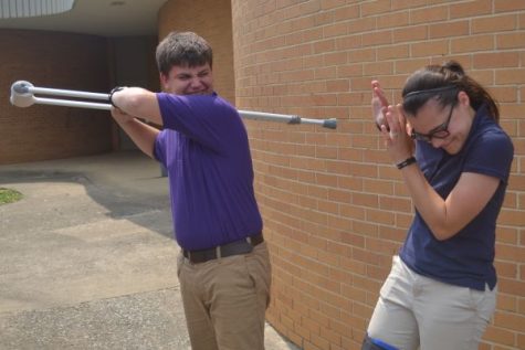 SENIOR VS. FRESHMAN -- Freshman Alex White pretends to beat up injured senior Haylee Smith.