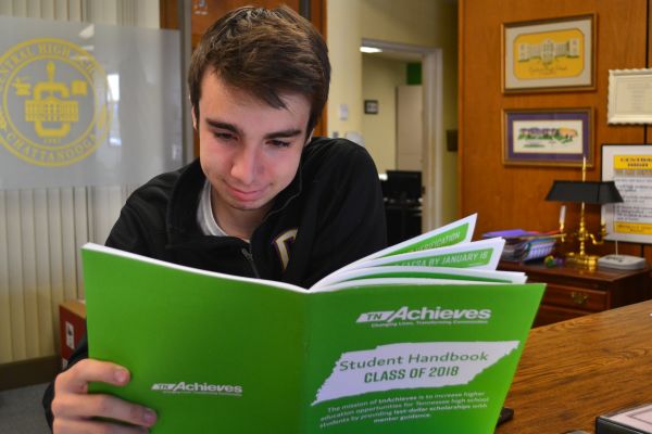 SENIORS NEED TO APPLY FOR THE TENNESSEE PROMISE-- Senior Brandon Irving reads the TN Promise handbook.