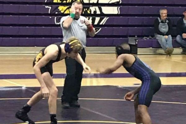 WRESTLERS PREPARE FOR THE UPCOMING SEASON -- Wrestler Aaron Smith pictured in a photo from one of last years matches is ready to take on the upcoming season. 