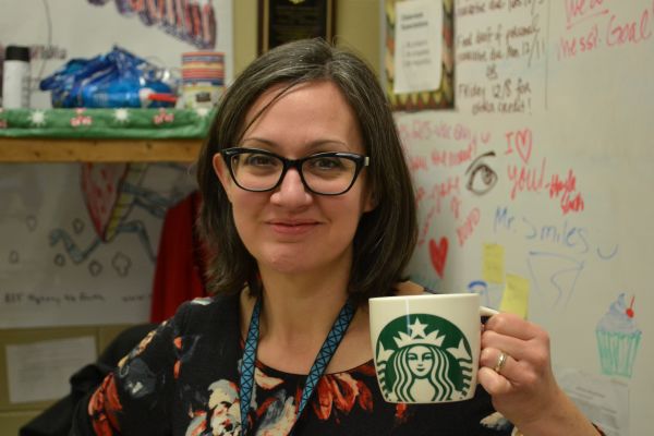 A CUP A DAY -- English Teacher Sally White poses with her Starbucks cup.