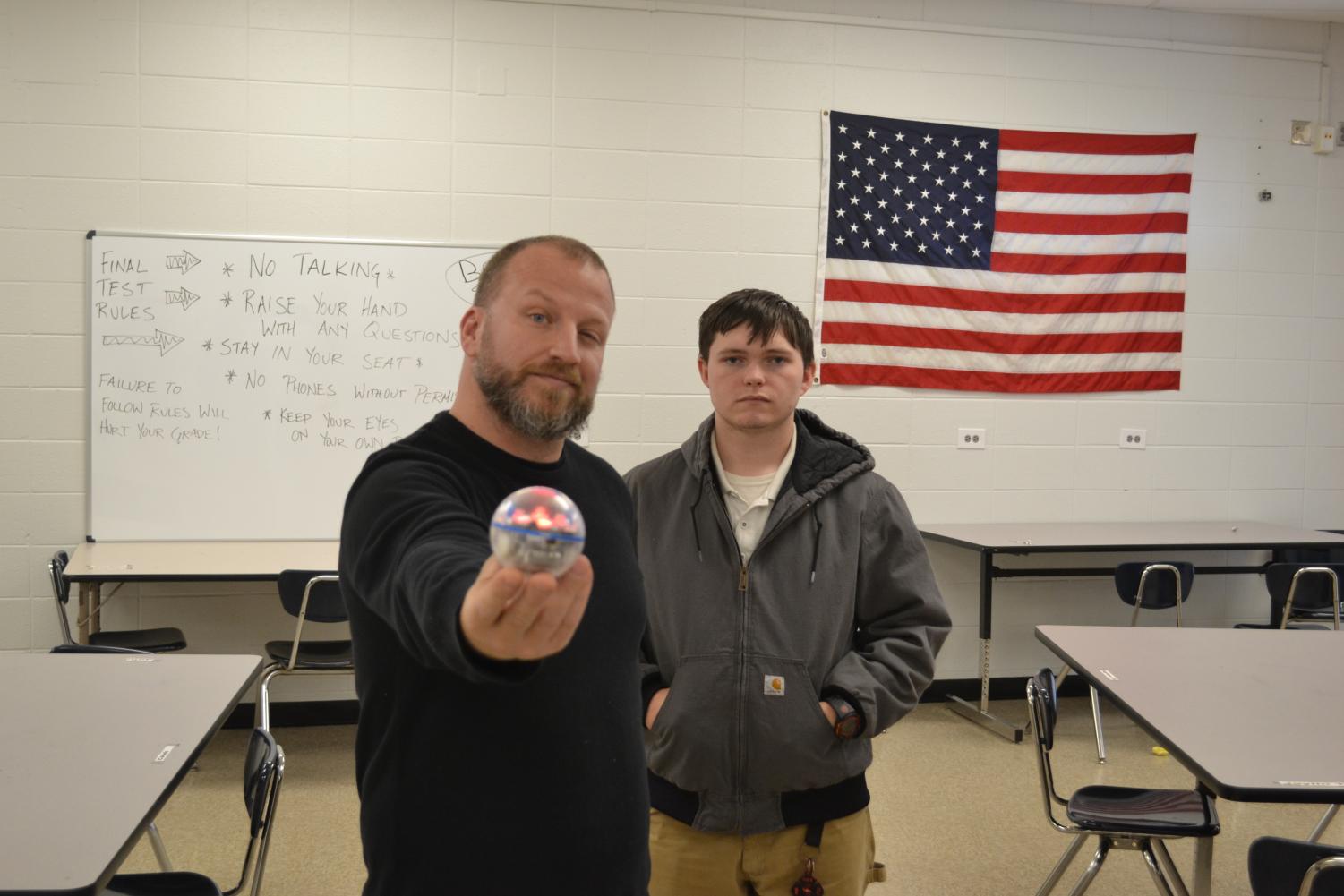 MECHATRONICS IF FLOURISHING IN FIRST YEAR AT CENTRAL -- Mr. King (left) and Gavin Rampagos (right) show off one of the Sphero balls