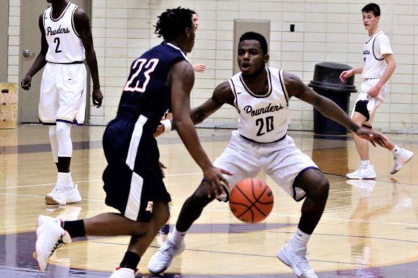 FIGHT POUNDERS FIGHT -- Junior player Darick Isom fights to Secure the Bag.