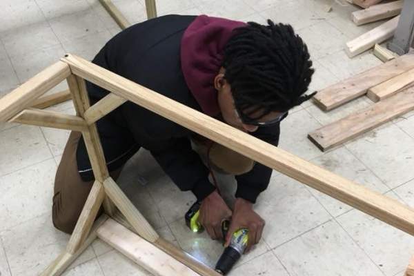 THE RWS NEXT GENERATION SUSTAINABLE LIVING PROGRAM -- Sophomore Jacob Sylman working on a chicken tractor.